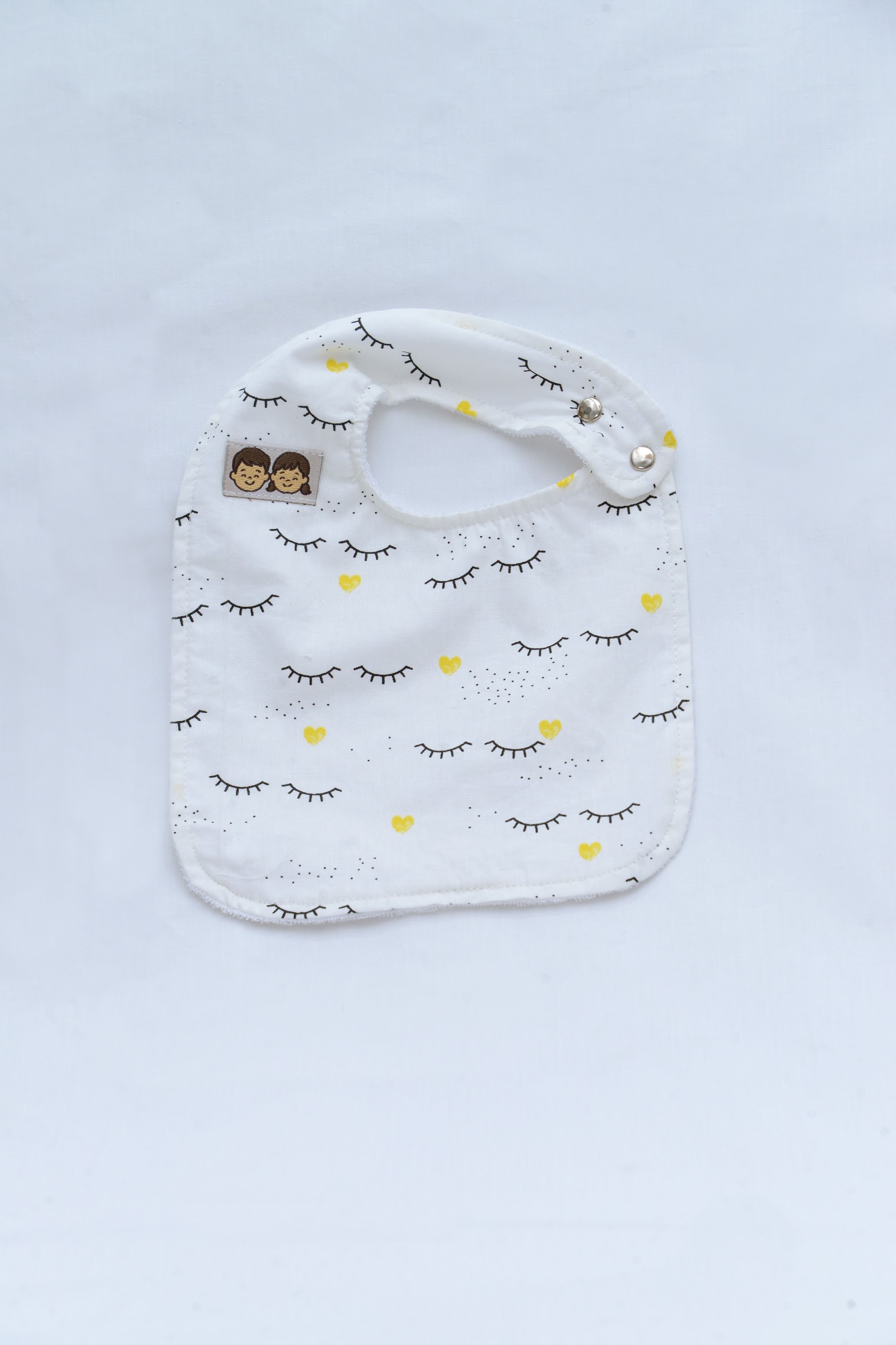 Bavoir Lashes Jaune